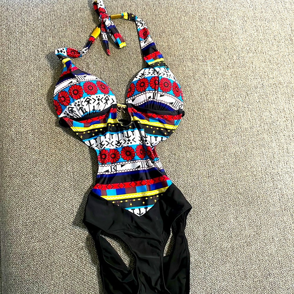 NWOT Multicolored Woman’s XL one piece bathing suit.